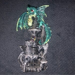 Green dragon on top of castle statue